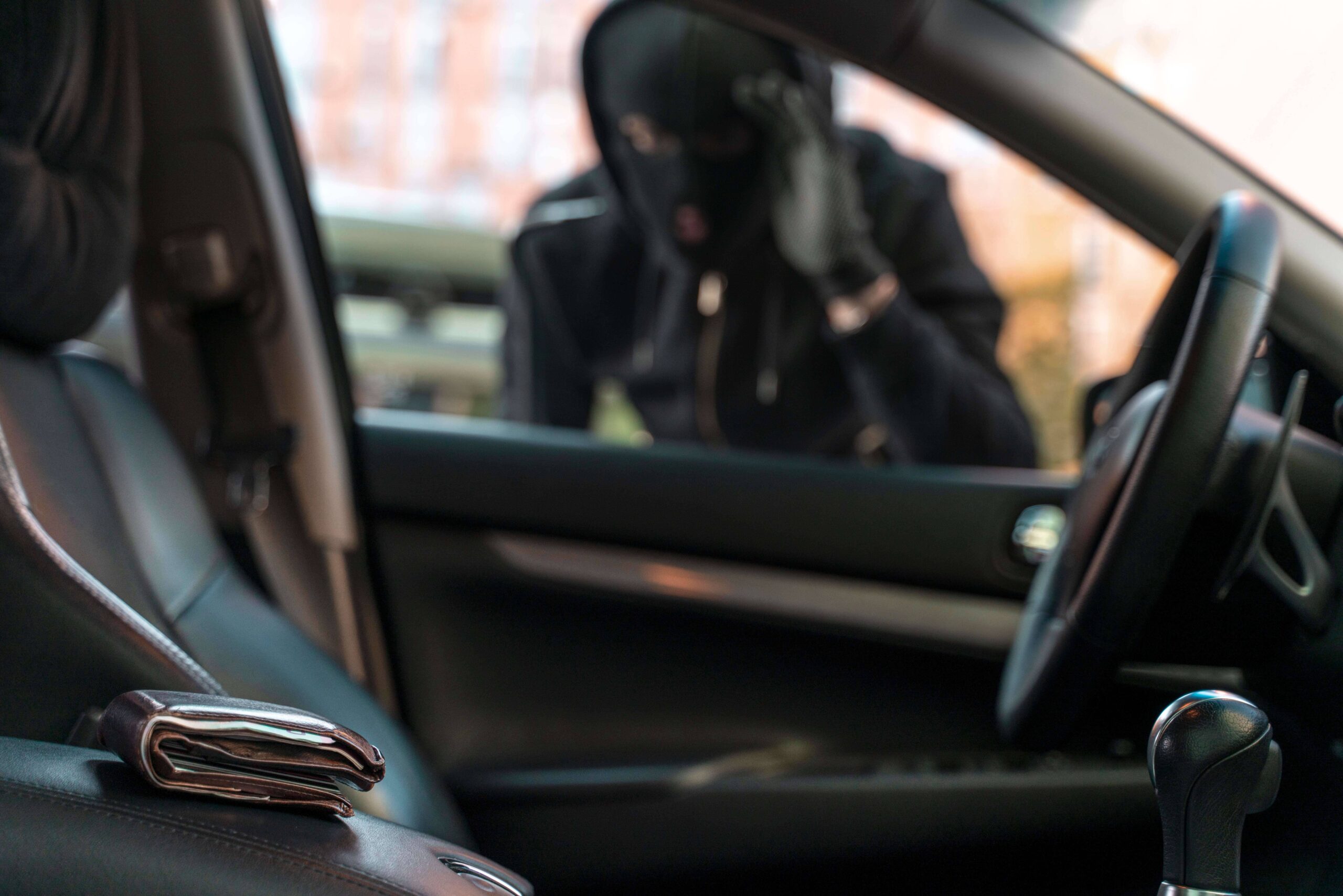 close-up-man-trying-break-into-car